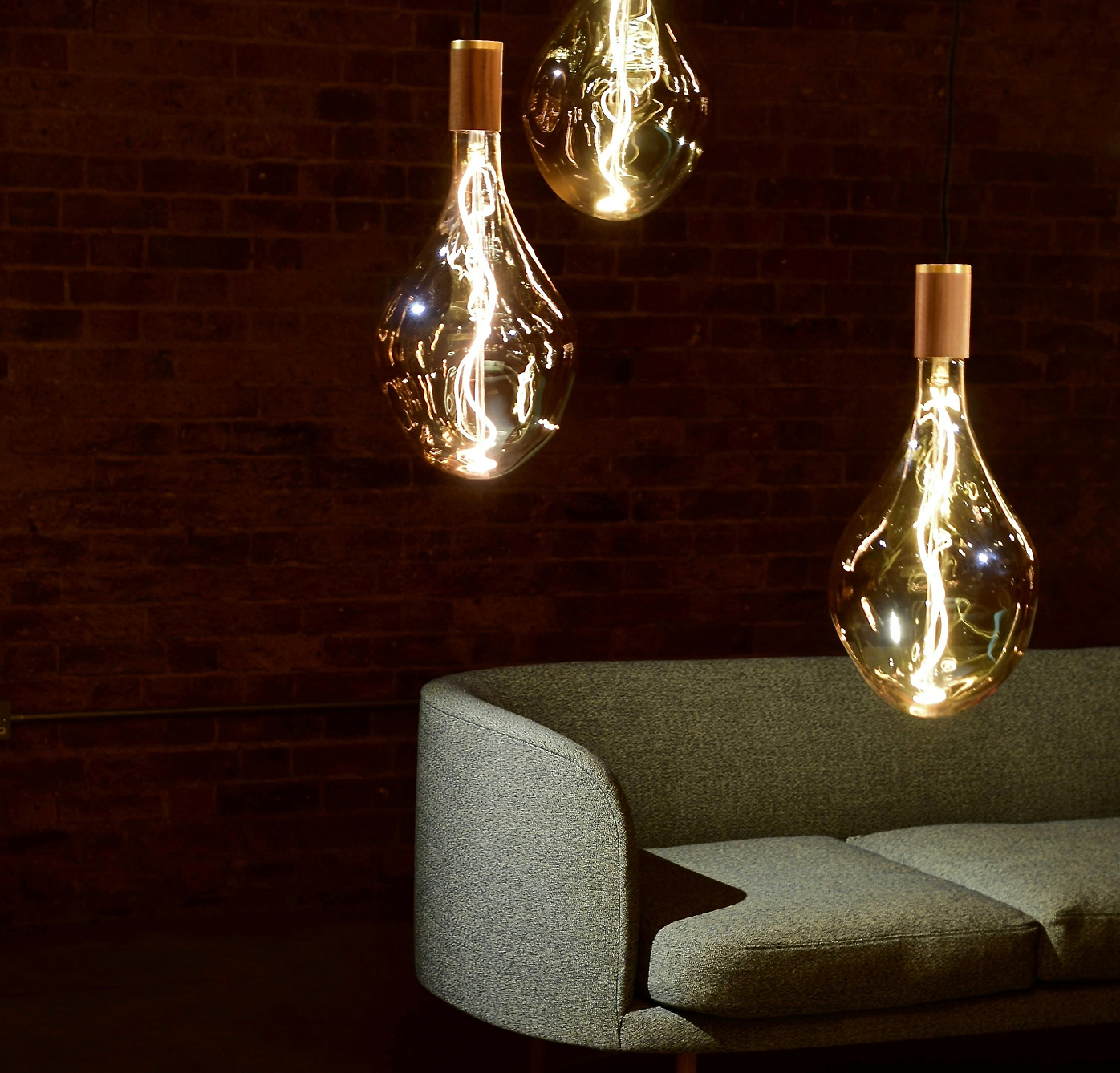 Warm interior lounge with sculptural pendant lighting